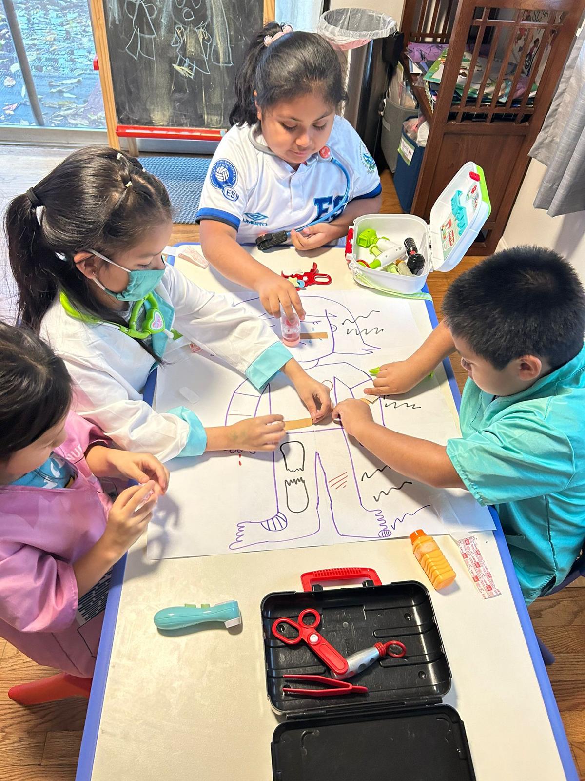 Children working together on a bilingual classroom activity with their teacher