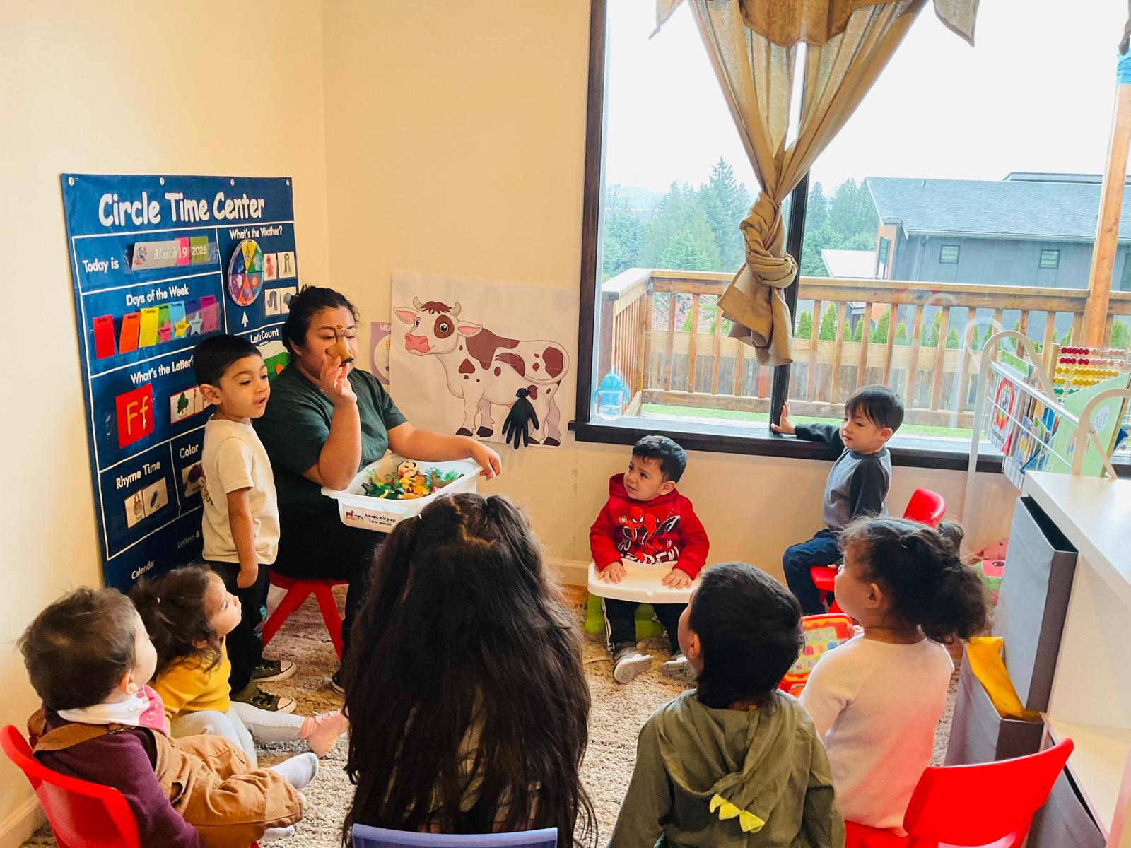 Teacher leading circle time with toddlers in the classroom